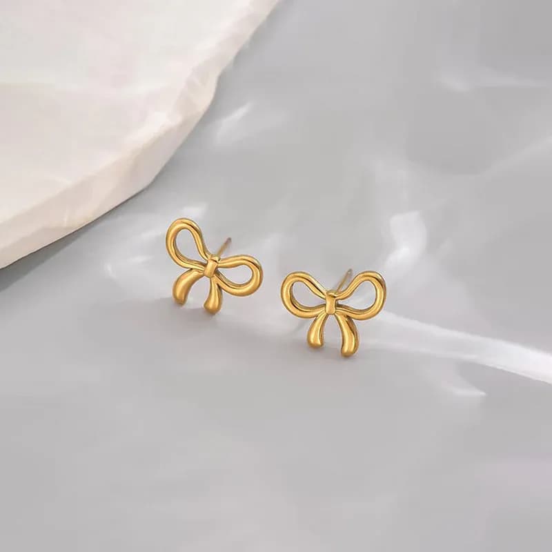 Niyanara Gold Plated Anti Tarnish Bow Themed Stud Earrings