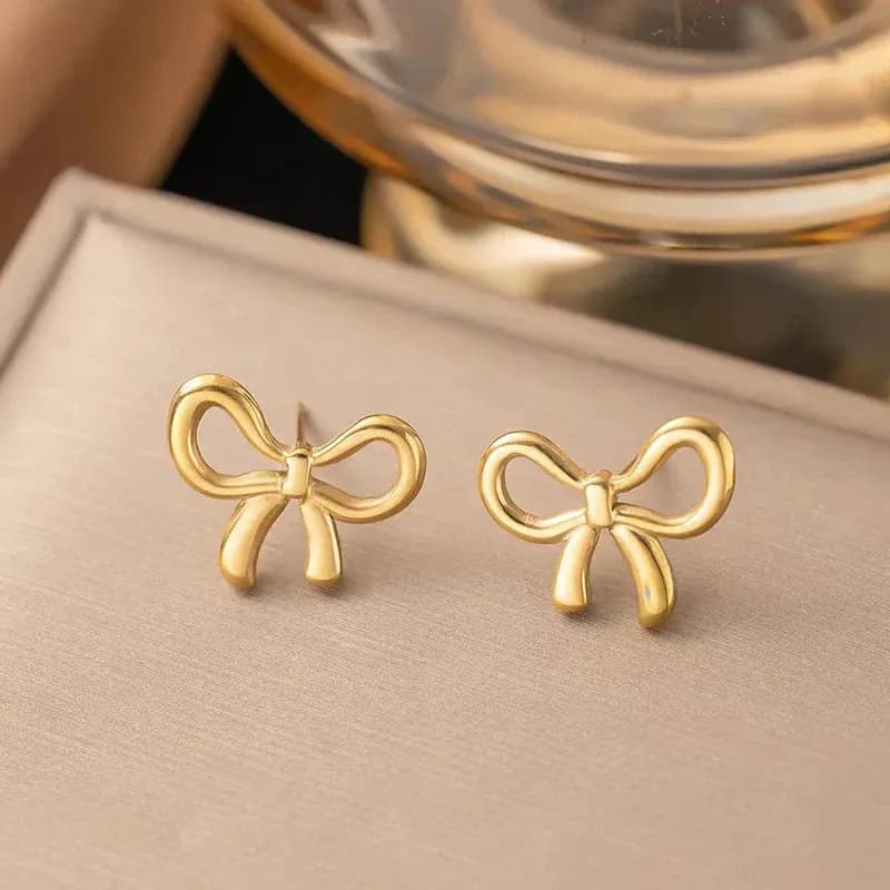 Niyanara Gold Plated Anti Tarnish Bow Themed Stud Earrings